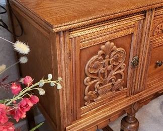 carving on oak dining buffet
