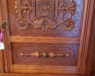 oak china cabinet with carving