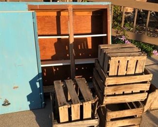 blue cabinet and apple crates
