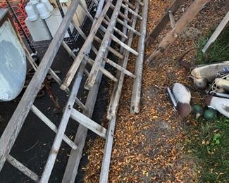 assortment of wooden ladders