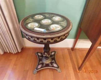 Pair of Sevres style porcelain and gilt bronze mahogany gueridon .