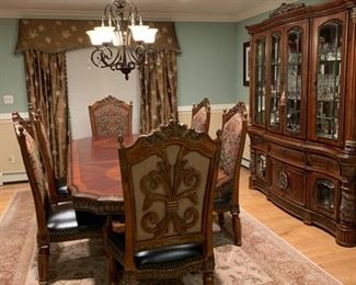 Tasteful Raymour & Flanigan Dining Rom Suite Complete with Lighted China Cabinet
Raymour & Flanigan Marble Accent Buffet Credenza