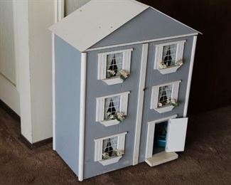 Fully furnished doll house with front opening.