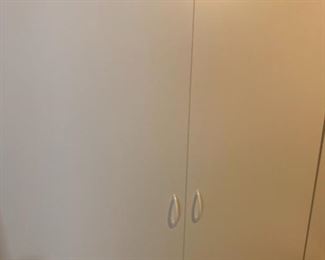 Several very large white storage cupboards. Great for bonus rooms, storage rooms, garages....