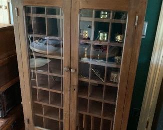 Cool display cabinet with lots of pigeon holes