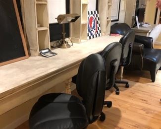 Three rolling office chairs