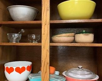 Pyrex refrigerator boxes, one large yellow mixing bowl, pink casserole, enamel bowl
