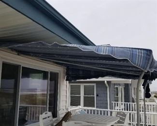 Canvas awning and stainless supports. Bill's Canvas in Woodbine. Must have proper tools to remove.