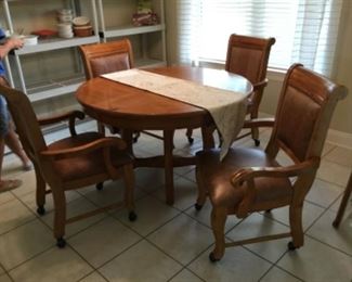 Wood dinette 48” - chairs on casters 4 with extra leaves.
