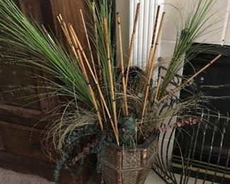 Tall lidded basket with ornamental decorations.
Measures proximately 46 inches tall.