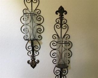 Metal and glass candle holders.
Measures 9” tall by 8” wide.
Glass is 8 1/2” tall.
Set of 2.