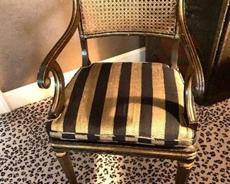 Pair cane back striped arm chairs