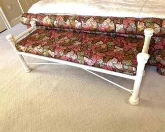 Painted iron bench with upholstered seat