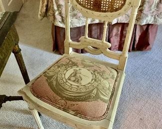 Vintage cane backed chair with upholstered toile seat