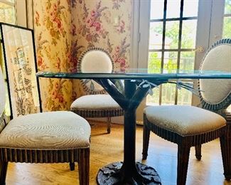 Beveled glass top table with metal tree limb base