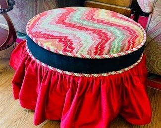 Custom upholstered, skirted ottoman on casters
