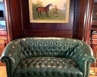 Hunter green leather tufted love seat with nail head trim