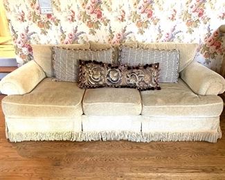 Beacon Hill three cushion rolled arm sofa with trim.