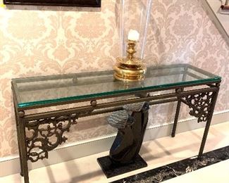 Ornate metal console table with glass top