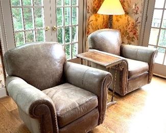 Pair  of Henredon swivel, rocking leather arm chairs