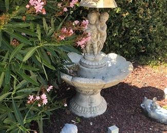 Cement Fountain.  Yard art potted plants