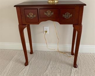 Table, brass hardware.