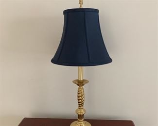 Twisted brass table lamp, blue textured shade with finial.