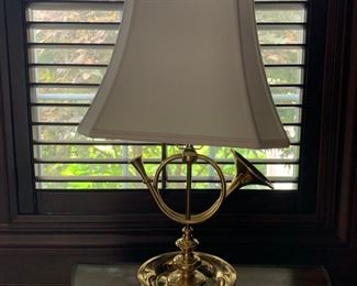 "Hunting Horn" brass table lamp, cream shade with finial.