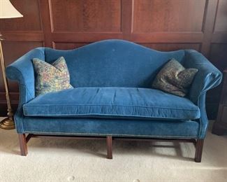 Settee, blue velvet, rolled arms, with nailhead trim.