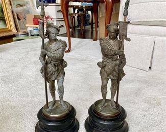 Spelter figures of cavaliers on heavy black base.