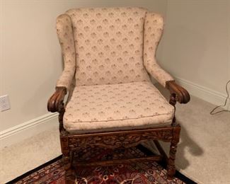 Arm chair, heavily carved apron, upholstered in cream floral fabric.