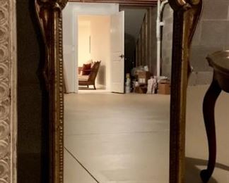 Decorative wall mirror, curved molding.