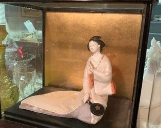 oriental dolls in glass cases