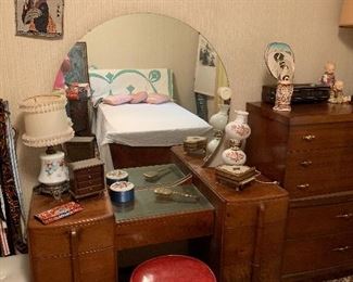 Dressing table with round mirror, twin quilt, lamps, and much more