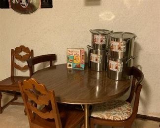 Round formula table, 2 pairs of chairs and brand new stock pots!