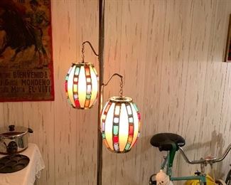 Mid century pole lamp! Oh, and a great vintage stationary bike!