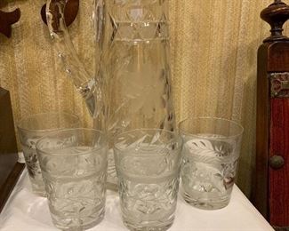 Beautiful cut glass water pitcher and cut glass glasses.