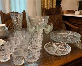 Beautiful cut glass high balls and champagne glasses, punch bowl with 8 cups and various beautiful cut glass serving pieces