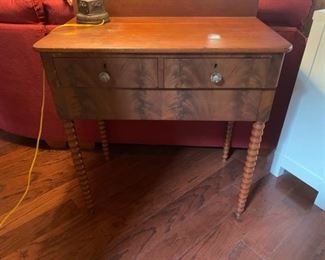 Burled wood, 2-drawer table with spool legs & glass drawer pulls.