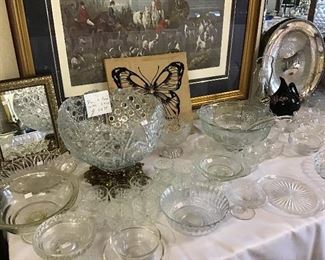 Large assortment of cut glass punch bowls, stemware, plates.