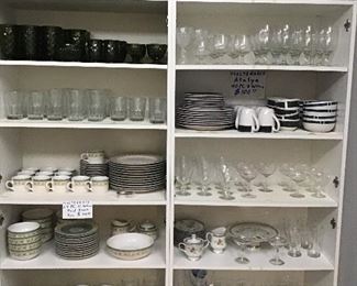 Assortment of fine china, stemware, glasses, bowls, green 1960’s-1970’s Fostoria Americana dinner glasses, juice glasses, stemmed dessert ware. Two PFLATZGRAFF dinner services for 12 and 8