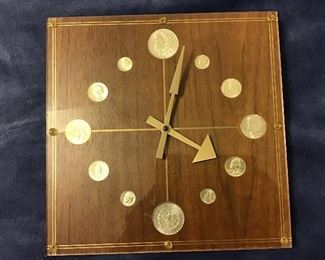 Marion Kay , model #101 Numismatic clock with 4-1964 silver dimes, 4-1964 silver quarters, 2-1964 silver 50 cent pieces , 2-1885-O silver dollars.