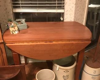 dropleaf table, crockery, and a double wooden wall pocket