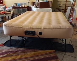 Frontgate E Z Bed Sleep and Save - self inflates and deflates. All compact on it's own bed frame, folds down into its own "luggage on wheels" for easy storage