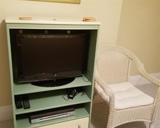 TV and cabinet, wicker chair