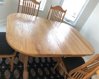 STURDY OAK TABLE  WITH CLAW FOOT PEDESTAL  BASE & 6 BENT WOOD CHAIRS IN GREAT CONDITION 
60”L x 42” W x 30” H 