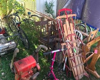 Old sleds, bikes, chairs, lots of old weed wackers, rototillers, quilt racks & more!