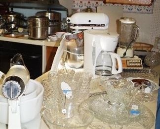 Kitchenaid mixer, electric knives, Fostoria glasses, blender, waffle irons,