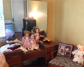 antique vanity. Small army of antique creepy dolls