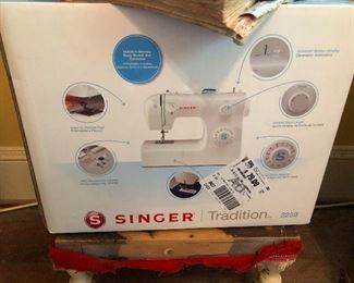 Singer sewing machine still in box. Learn a skill! It helps to be useful in the apocalypse 